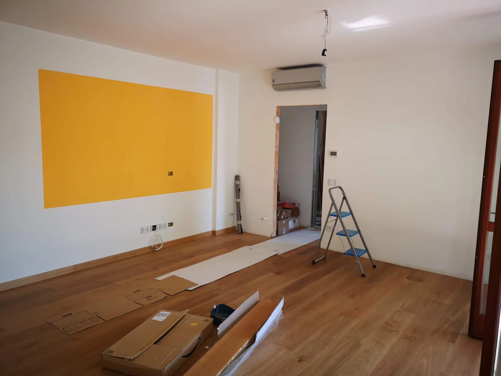 Flooring being installed plank by plank